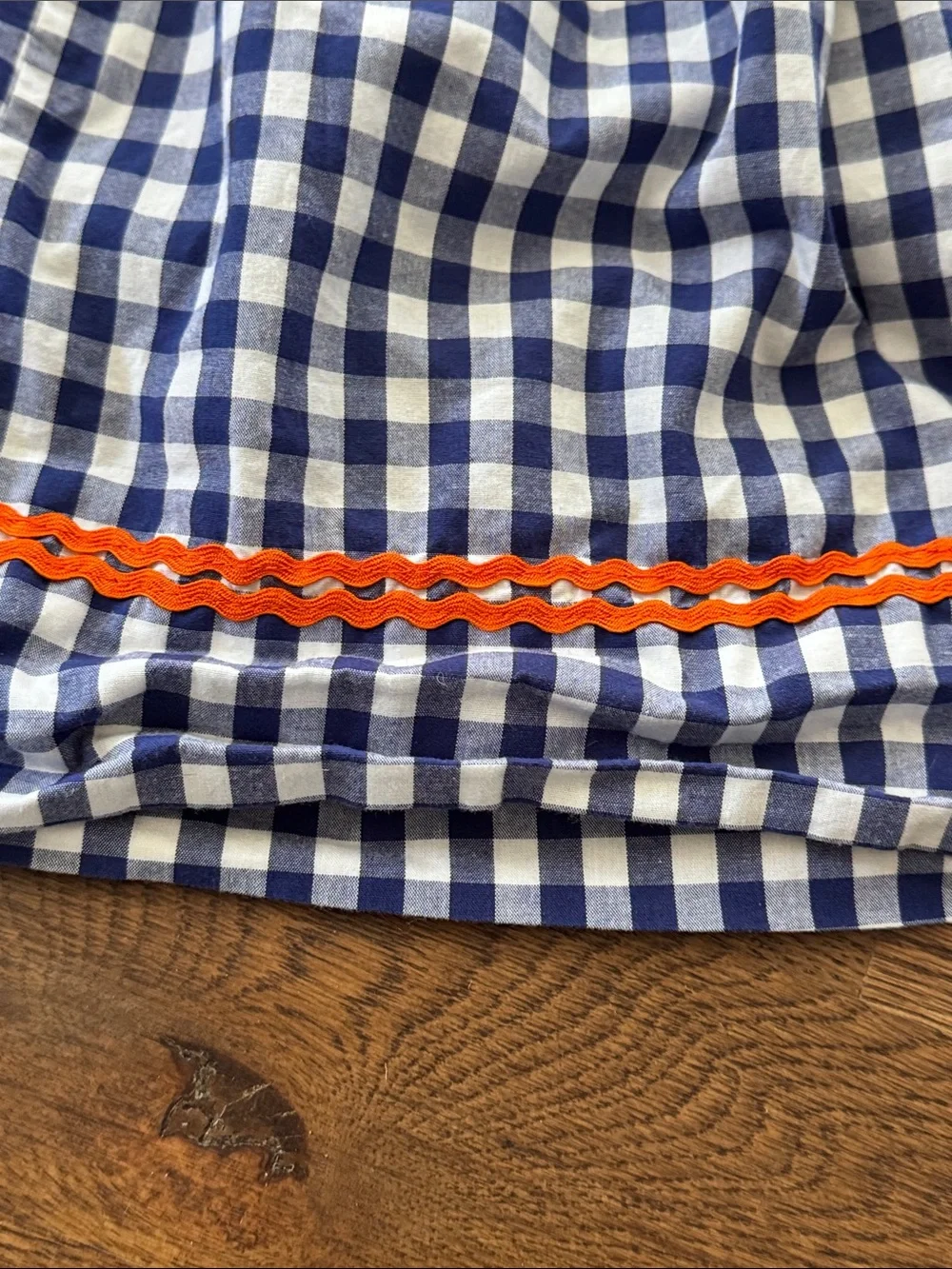 Cecil And Lou Navy Gingham Smocked Dress with Smocked Orange Pumpkin Embroidery